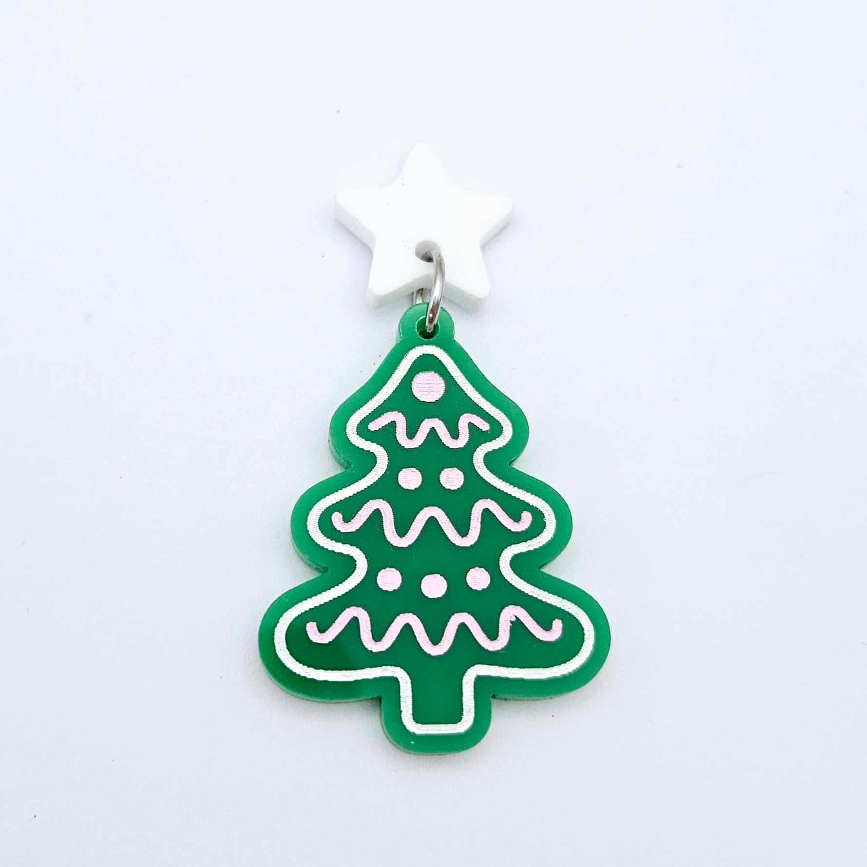 One solid green cookie Christmas tree dangle with engraved icing details paint filled in light pink and white, assembled with a 16mm white star topper