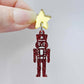 Assembled 40mm nutcracker Christmas dangle earrings in red glitter acrylic with engraved detail paint filled white