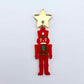 Assembled 40mm nutcracker Christmas dangle earrings in red acrylic with engraved detail paint filled with green and white