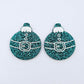 One pair of teal glitter Santa bauble dangle blanks with engraved Santa belt and button details paint filled white, shown laying flat