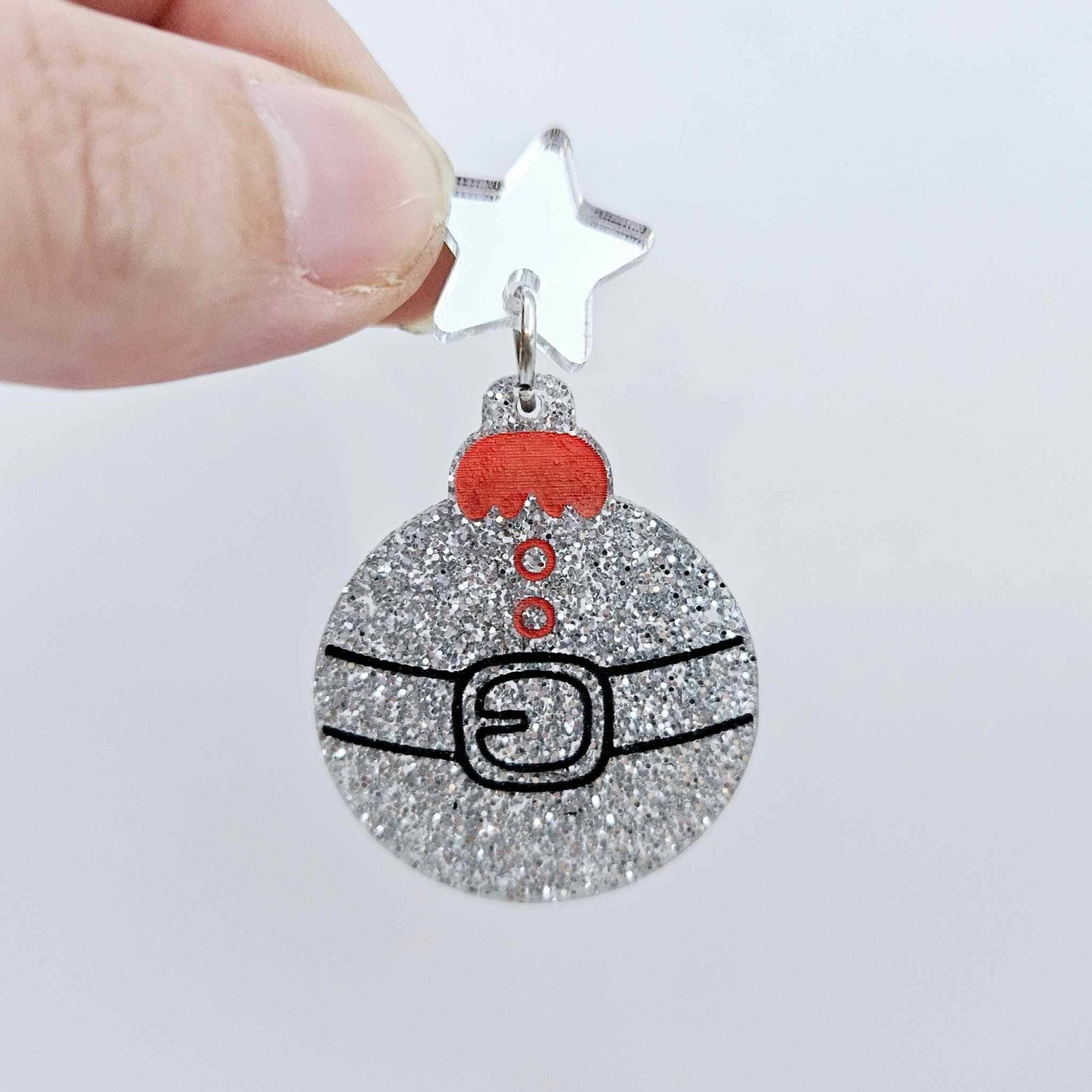 One silver glitter Santa bauble dangle with engraved Santa belt and button details paint filled red and black, assembled with a 16mm silver mirror star topper