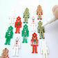 40mm nutcracker Christmas dangle blanks with engraved paint-fill details shown in green, red and white acrylic