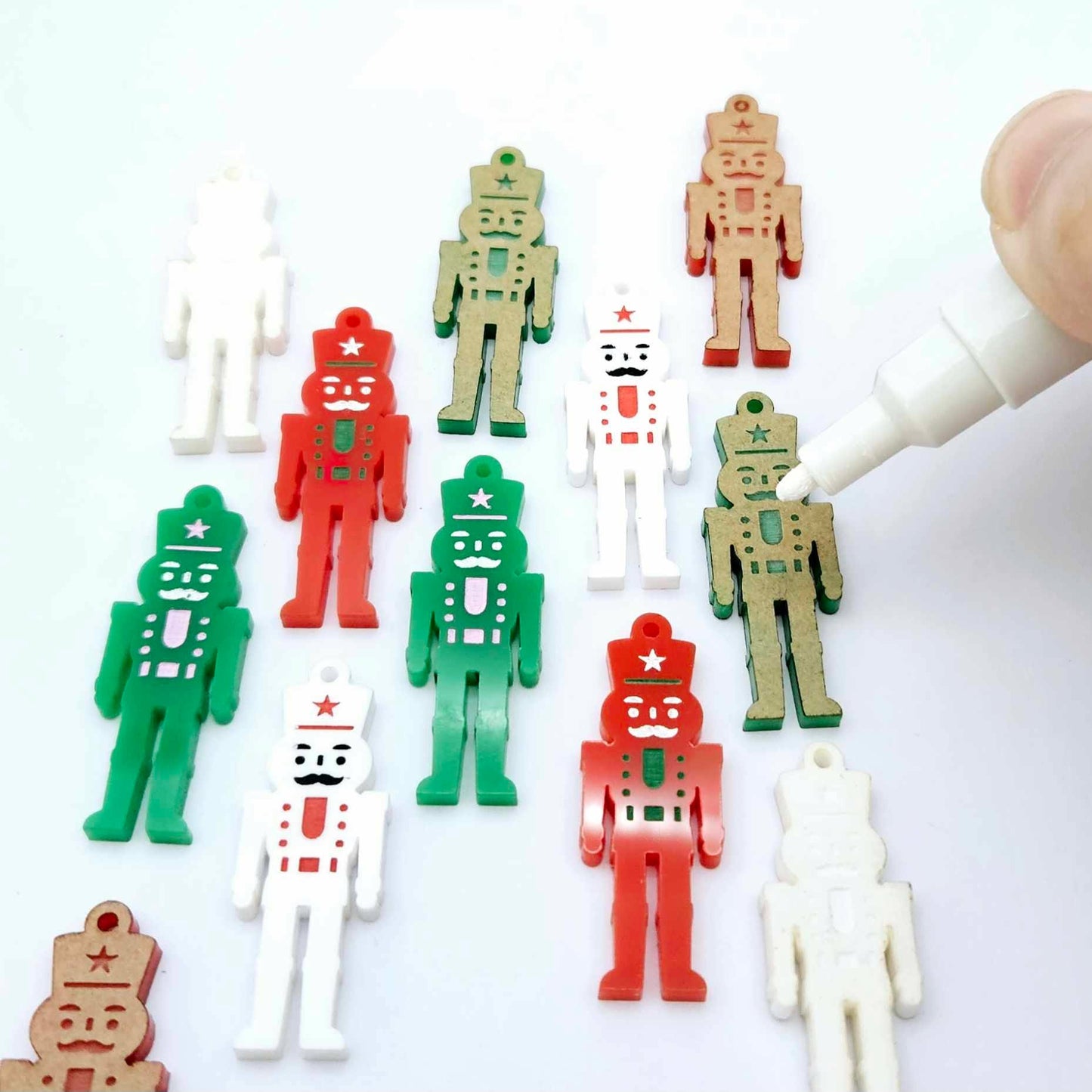40mm nutcracker Christmas dangle blanks with engraved paint-fill details shown in green, red and white acrylic