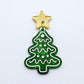 One green marble cookie Christmas tree dangle with engraved icing details paint filled in light pink and white, assembled with a 16mm gold mirror star topper