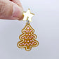 One gold pearl marble cookie Christmas tree dangle with engraved icing details paint filled in light pink and white, assembled with a 16mm gold mirror star topper