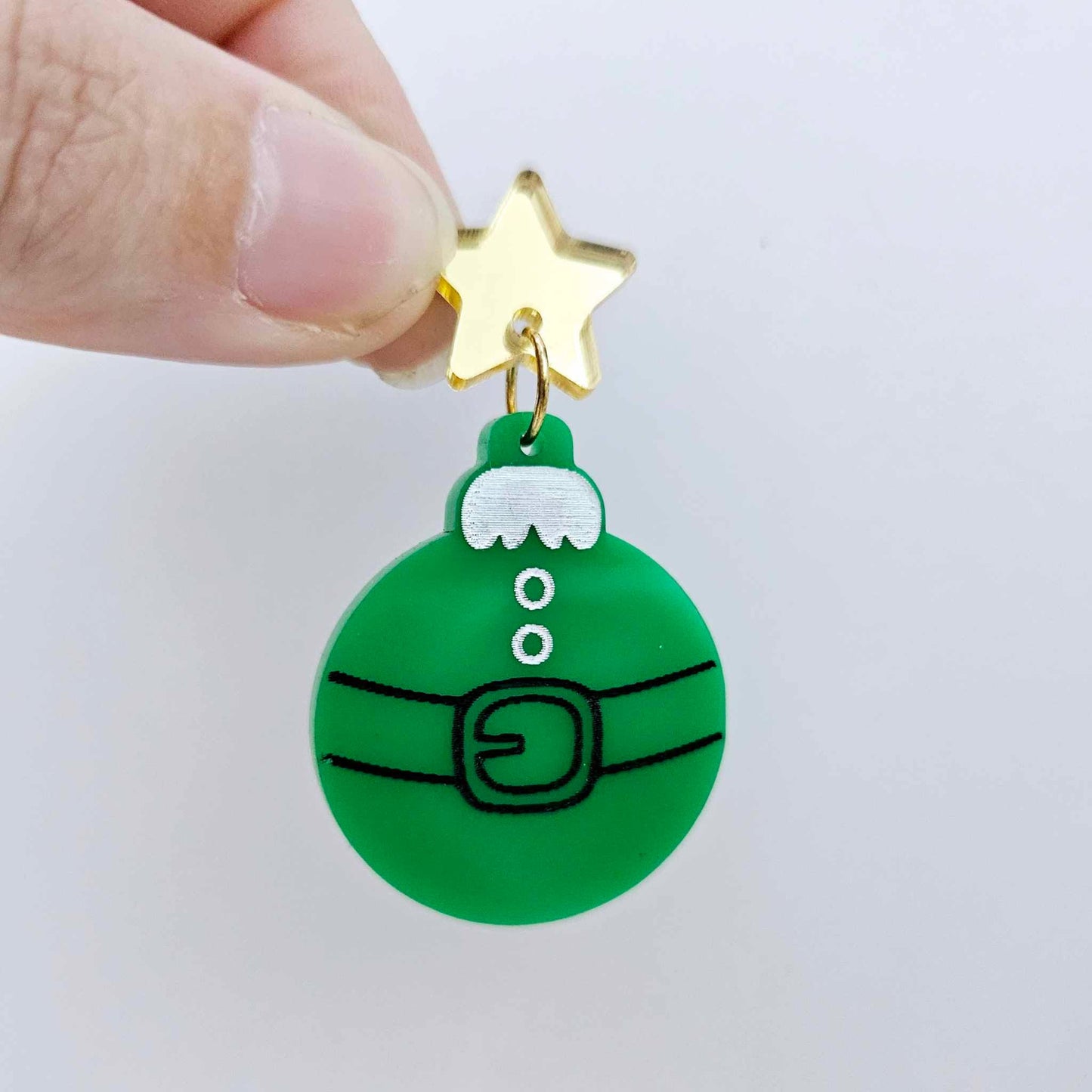 One solid green Santa bauble dangle with engraved Santa belt and button details paint filled in black and white, assembled with a 16mm gold mirror star topper