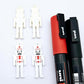 40mm nutcracker Christmas dangle blanks with engraved paint-fill details shown in  white acrylic with black and red posca paint pens
