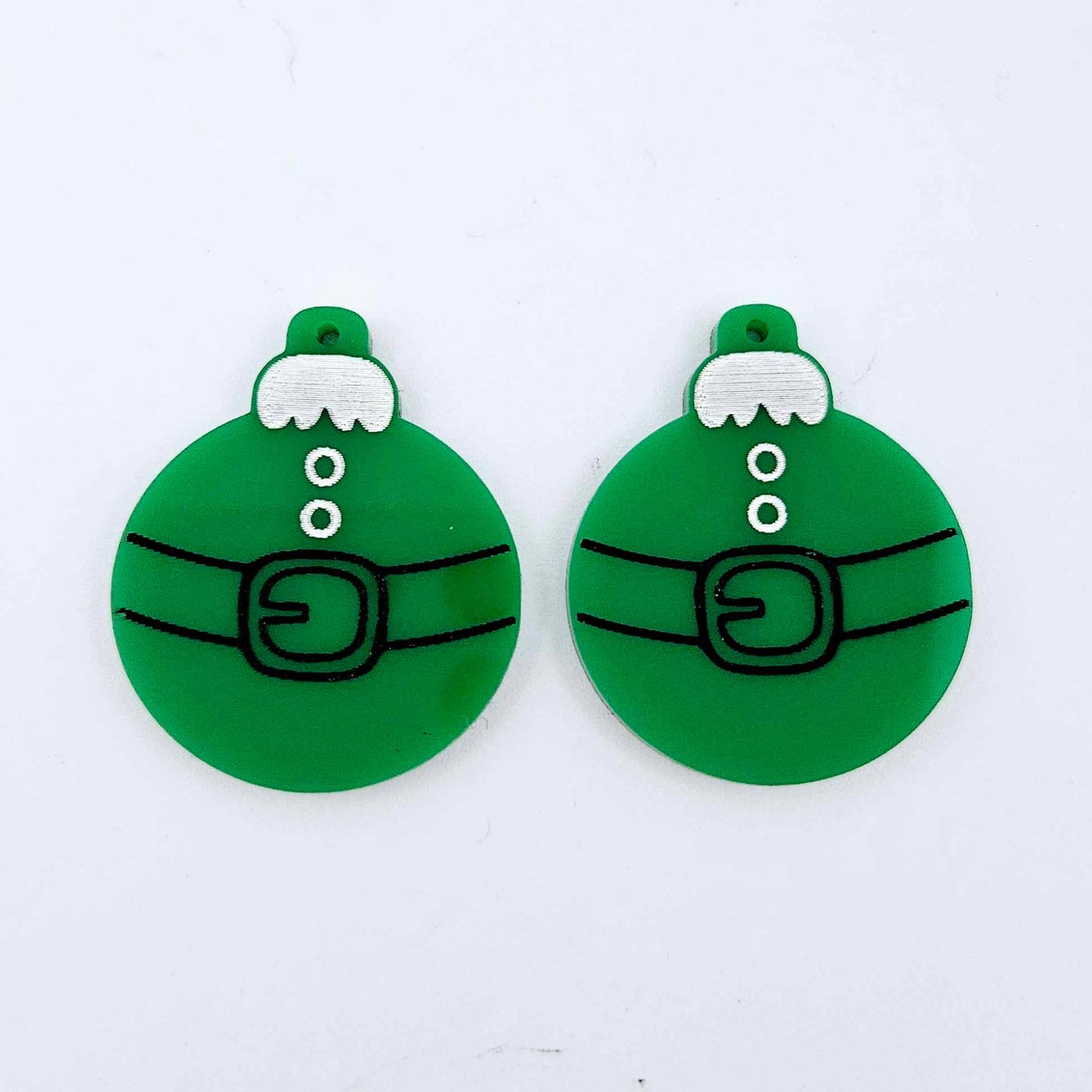 One pair of solid green Santa bauble dangle blanks with engraved Santa belt and button details paint filled in black and white, shown laying flat