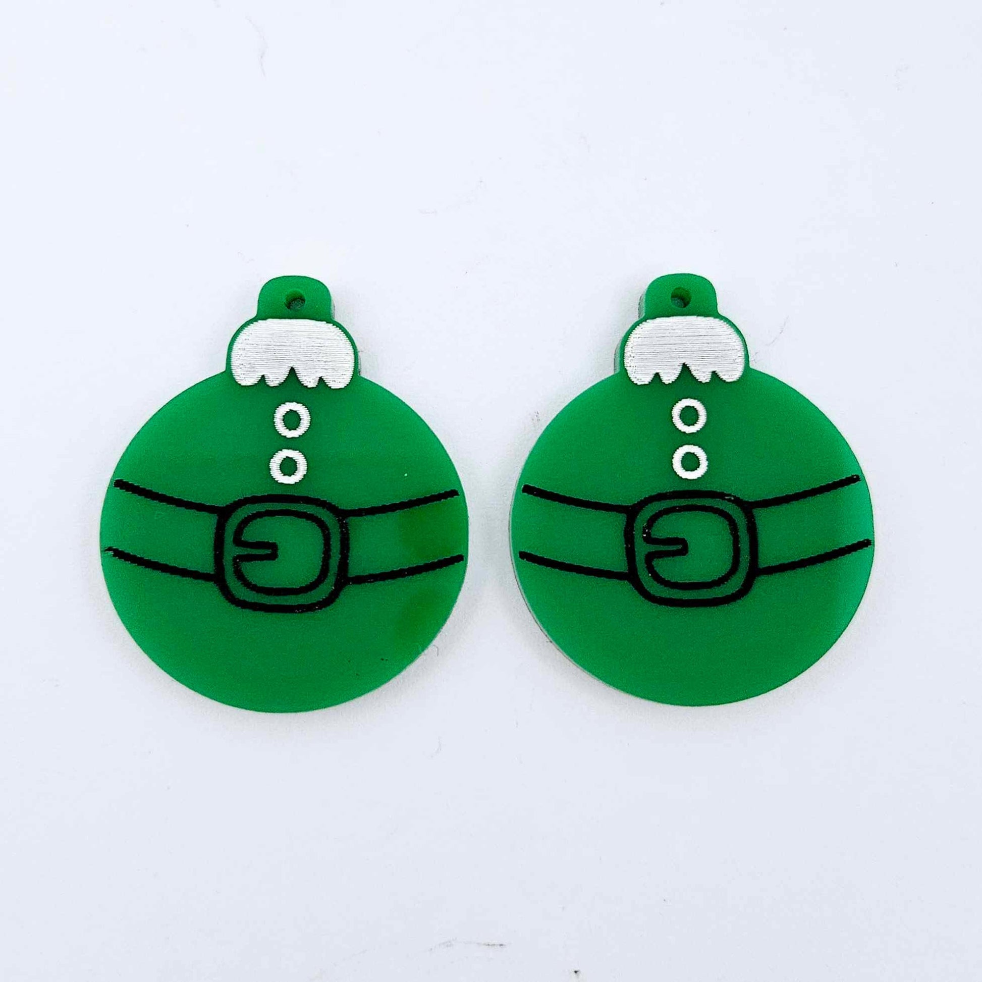 One pair of solid green Santa bauble dangle blanks with engraved Santa belt and button details paint filled in black and white, shown laying flat