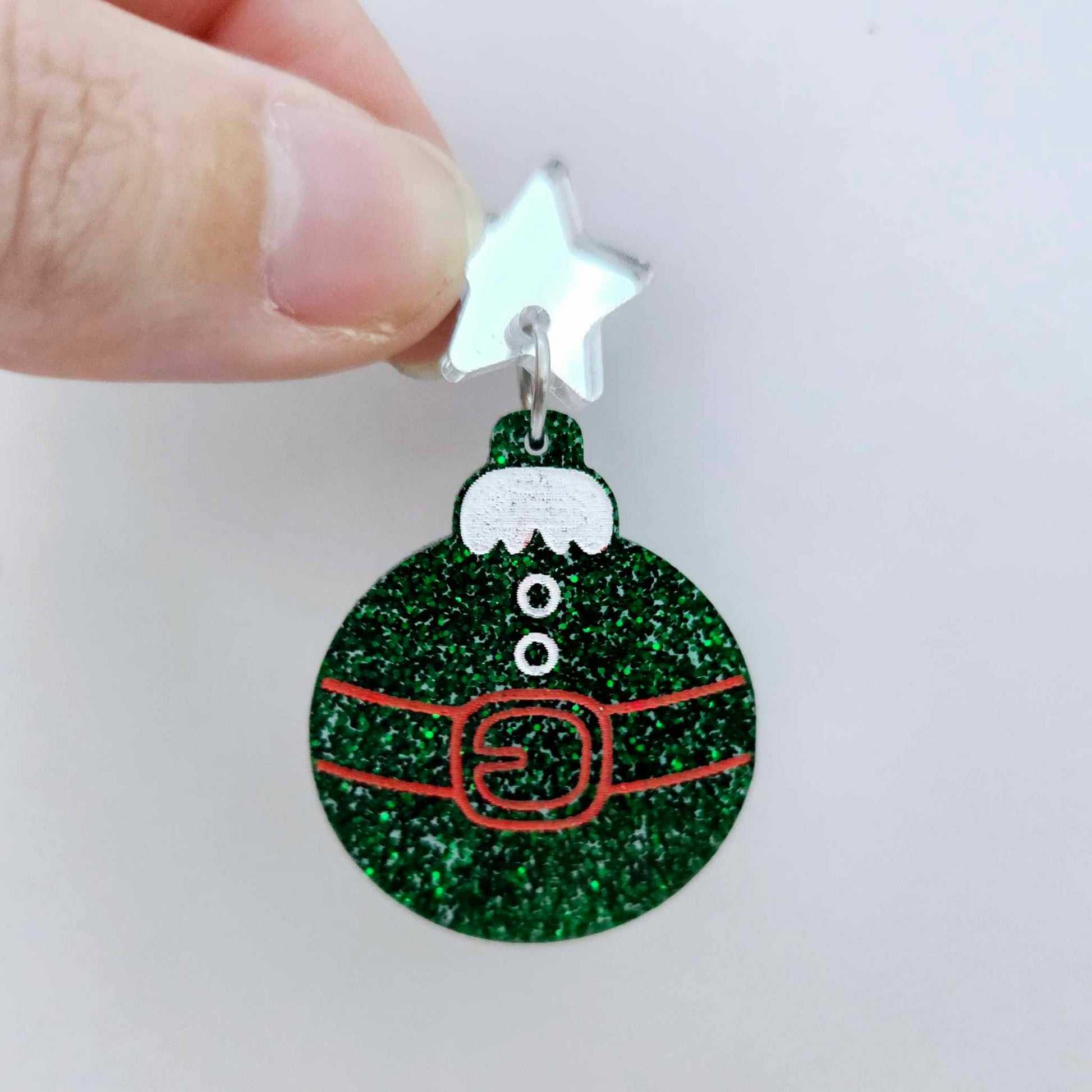 One green glitter Santa bauble dangle with engraved Santa belt and button details paint filled red and white, assembled with a 16mm silver mirror star topper