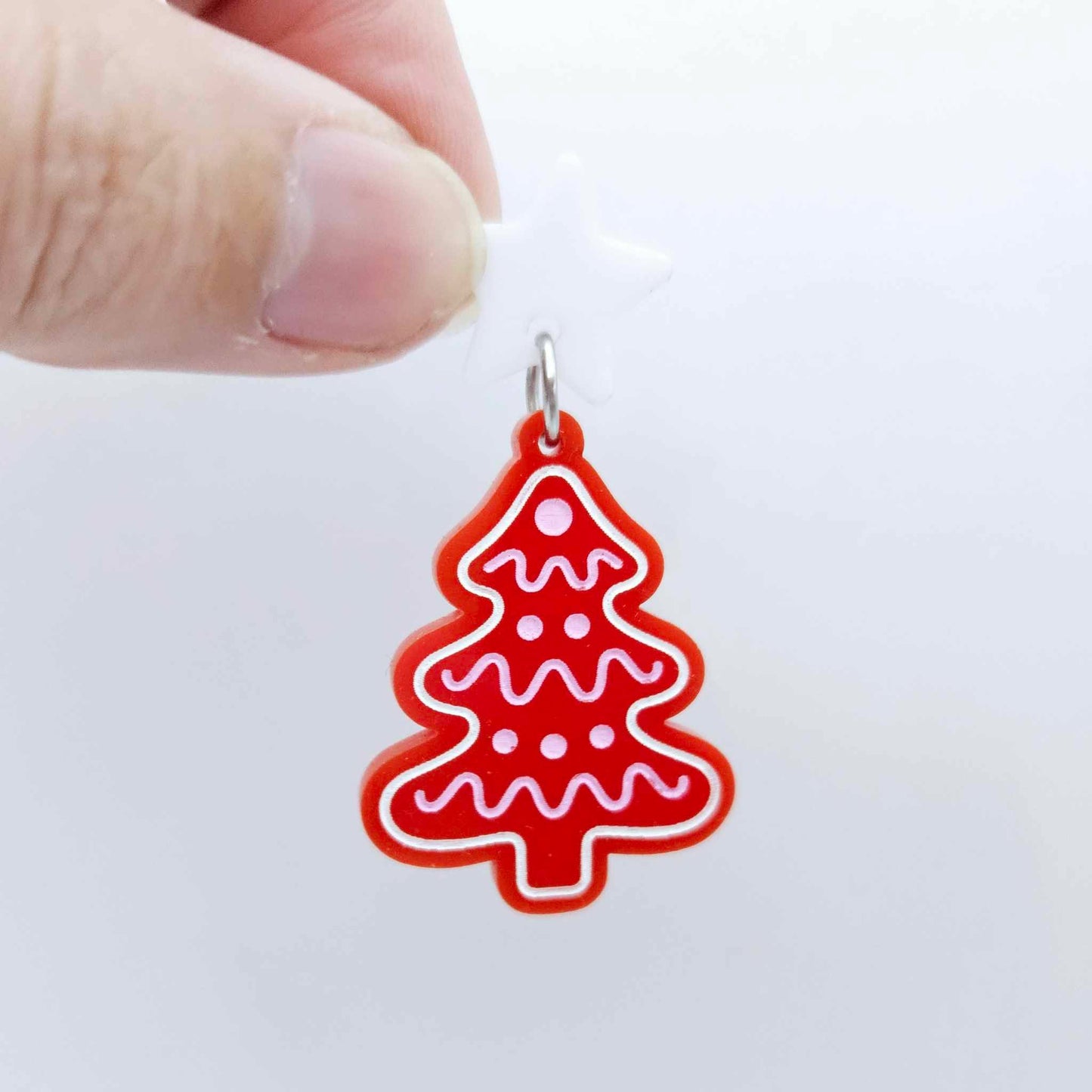 One solid red cookie Christmas tree dangle with engraved icing details paint filled in light pink and white, assembled with a 16mm white star topper