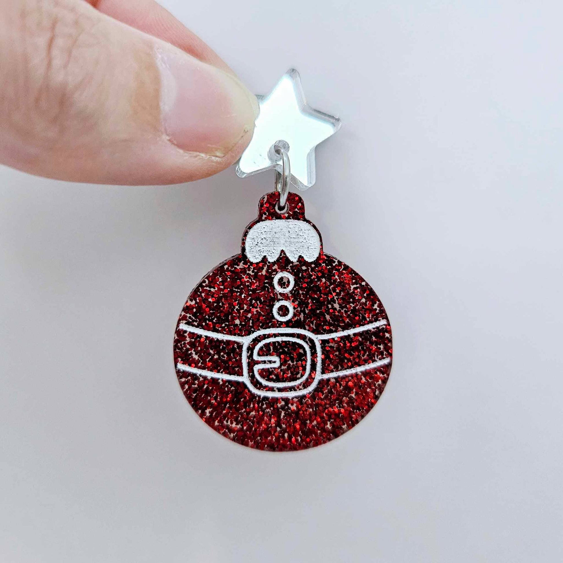 One red glitter Santa bauble dangle with engraved Santa belt and button details paint filled white, assembled with a 16mm silver mirror star topper