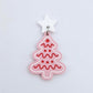 One pastel pink cookie Christmas tree dangle with engraved icing details paint filled in red and white, assembled with a 16mm white star topper