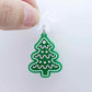 One solid green cookie Christmas tree dangle with engraved icing details paint filled in light pink and white, assembled with a 16mm white star topper