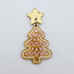 One gold pearl marble cookie Christmas tree dangle with engraved icing details paint filled in light pink and white, assembled with a 16mm gold mirror star topper