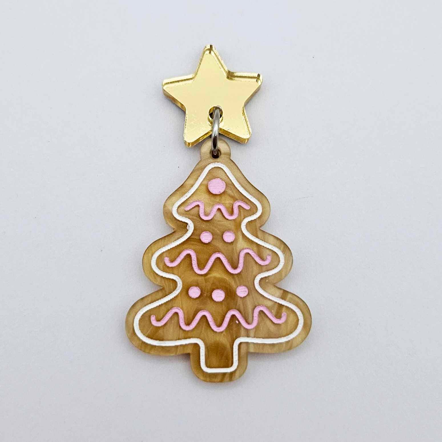 One gold pearl marble cookie Christmas tree dangle with engraved icing details paint filled in light pink and white, assembled with a 16mm gold mirror star topper