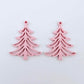 One pair of 35mm pastel pink acrylic Cascade Christmas Tree dangle earring blanks laying flat on a white background
