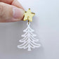 One 35mm white acrylic Cascade Christmas Tree dangle blank assembled with a 16mm star topper, shown as a finished earring component
