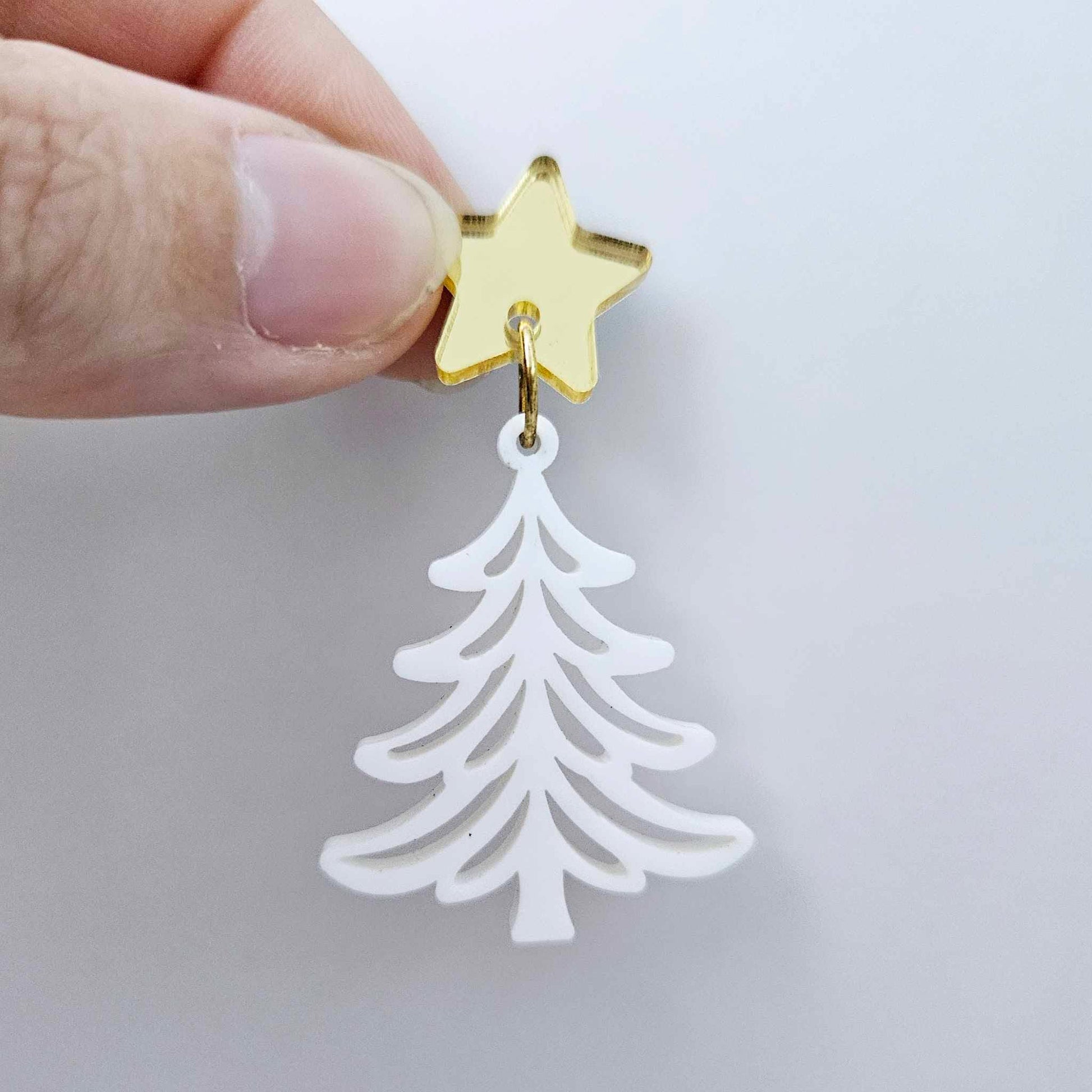 One 35mm white acrylic Cascade Christmas Tree dangle blank assembled with a 16mm star topper, shown as a finished earring component