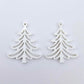 One pair of 35mm white acrylic Cascade Christmas Tree dangle blanks laying flat on a white background.