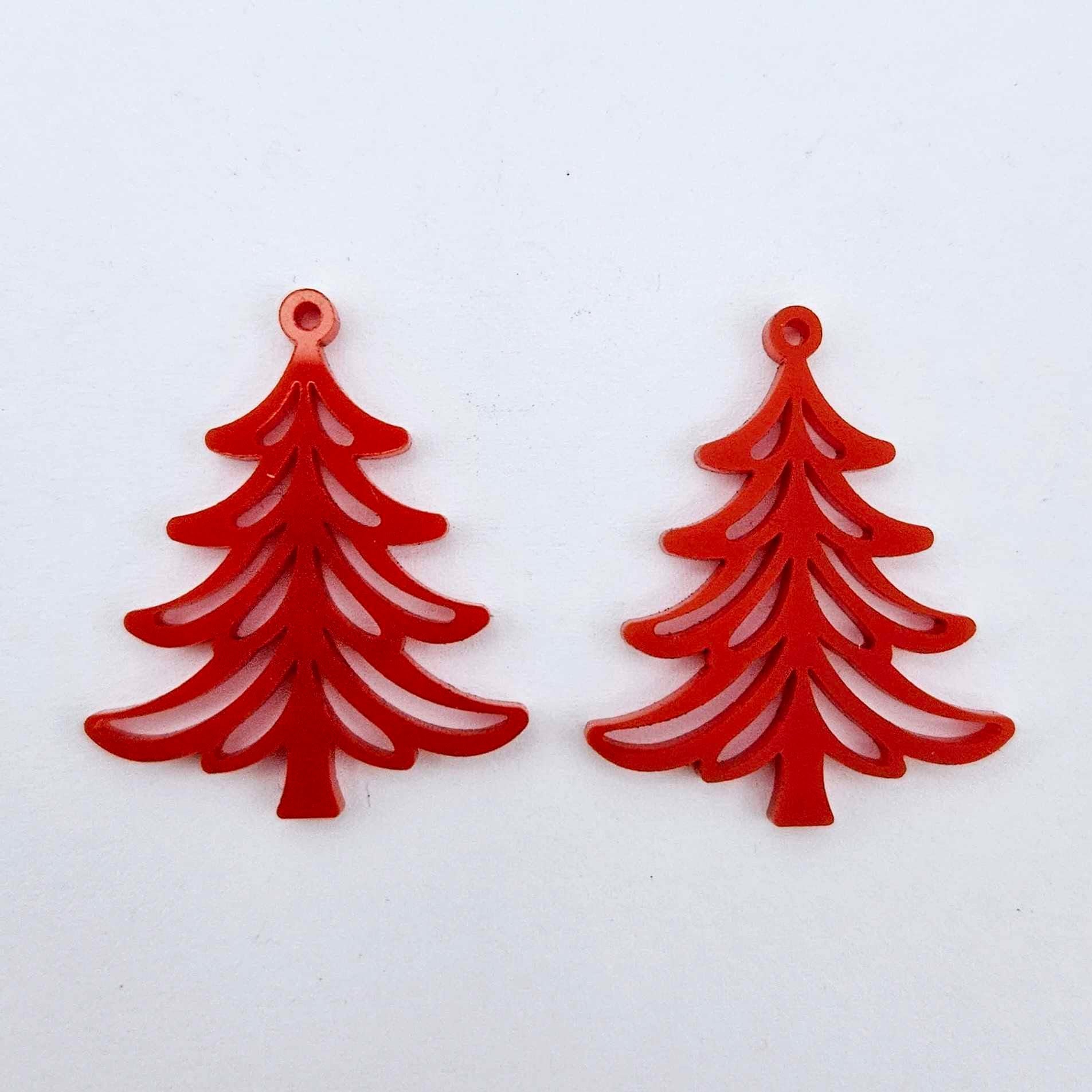 One pair of 35mm solid red Cascade Christmas Tree dangle blanks laying flat on a white background