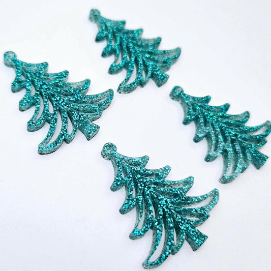 Two pairs of 35mm teal glitter acrylic Cascade Christmas Tree dangle earring blanks laying flat on a white background