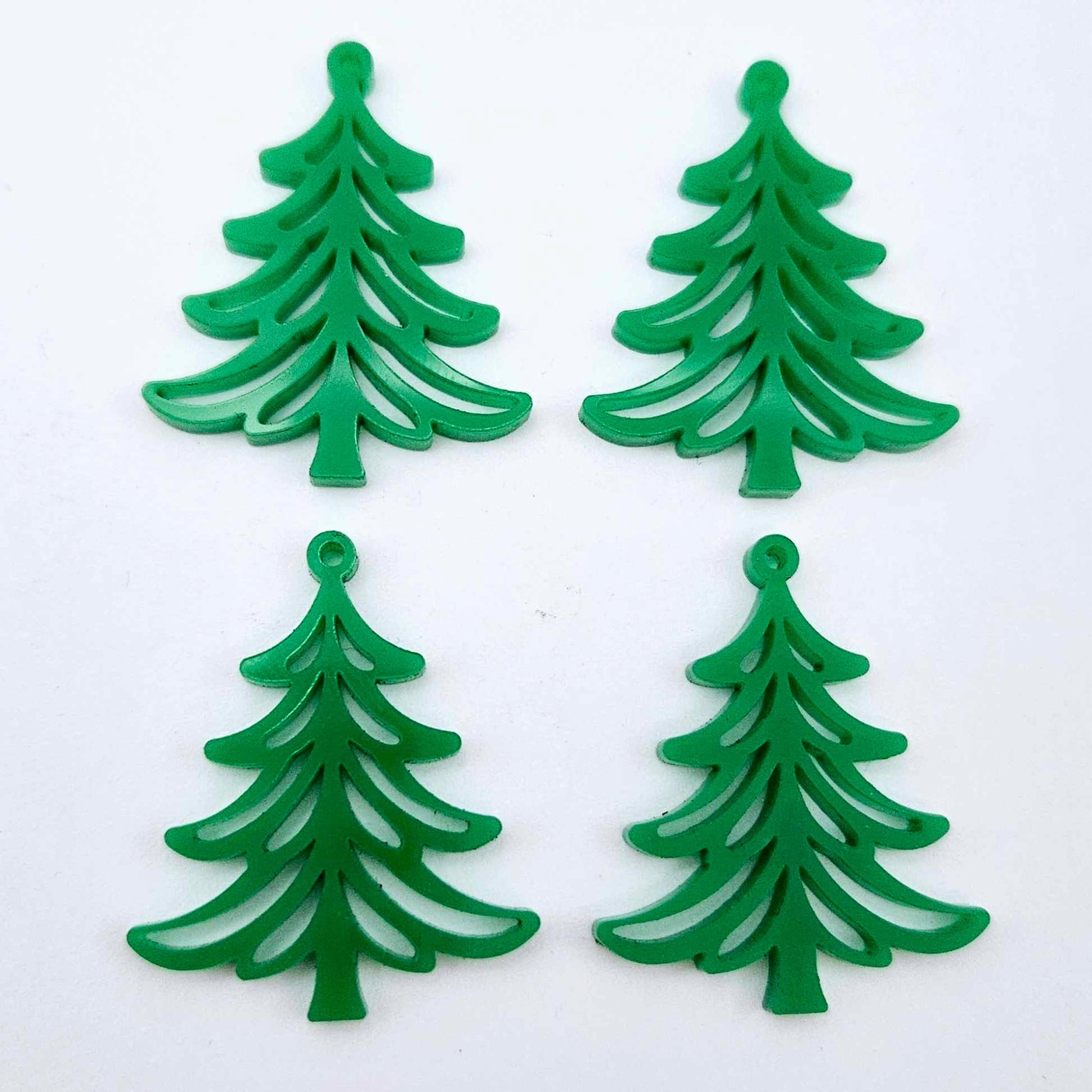 Two pairs of 35mm solid green Cascade Christmas Tree dangle earring blanks laying flat on a white background