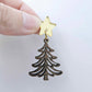 One 35mm walnut veneer Cascade Christmas Tree dangle earring blank assembled with a 16mm star topper, shown as a finished earring component