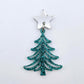 One 35mm teal glitter acrylic Cascade Christmas Tree dangle earring blank assembled with a 16mm star topper, shown as a finished earring component