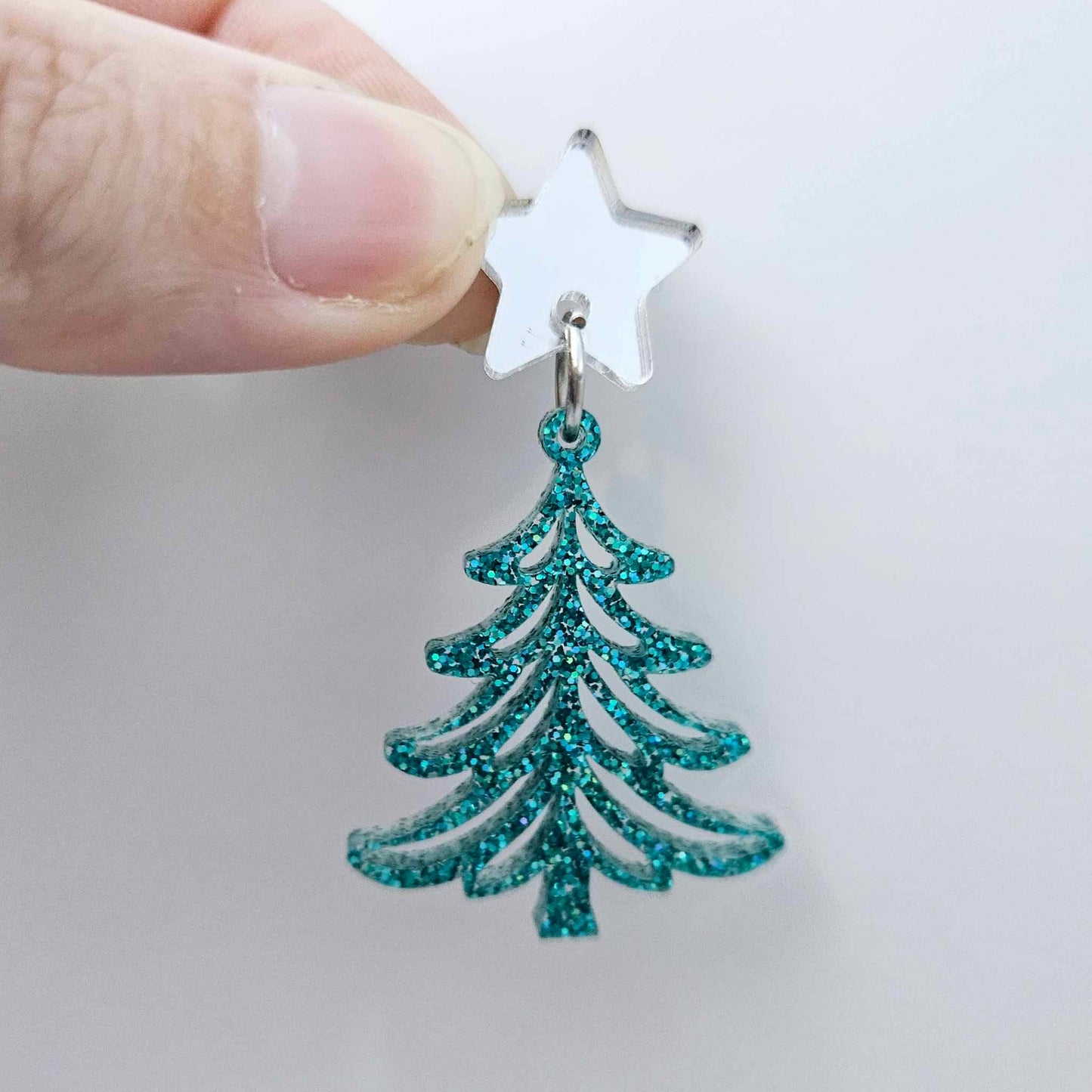 One 35mm teal glitter acrylic Cascade Christmas Tree dangle earring blank assembled with a 16mm star topper, shown as a finished earring component