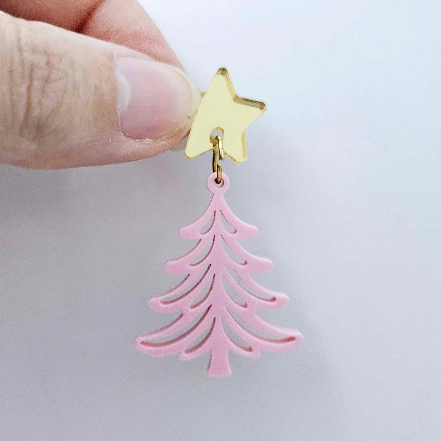 One 35mm pastel pink acrylic Cascade Christmas Tree dangle earring blank assembled with a 16mm star topper, shown as a finished earring component