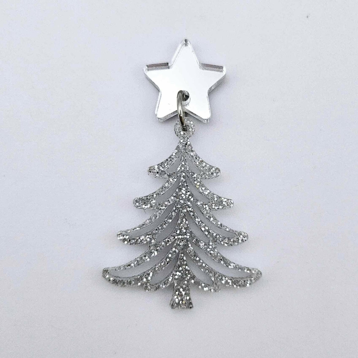 One 35mm silver glitter acrylic  Cascade Christmas Tree dangle earring blank assembled with a 16mm star topper, shown as a finished earring component