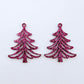 One pair of 35mm hot pink glitter Cascade Christmas Tree dangle earring blanks laying flat on a white background