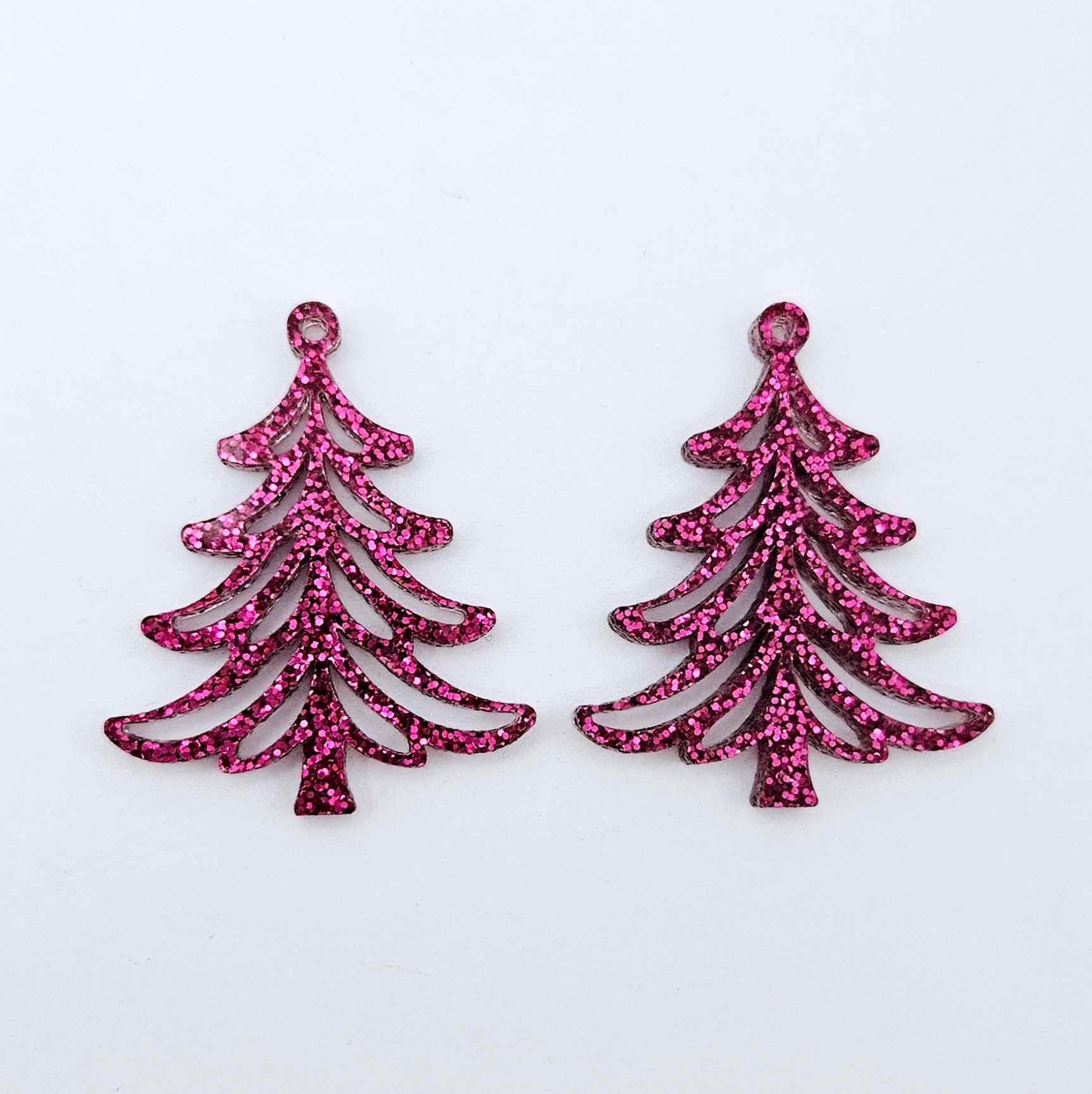 One pair of 35mm hot pink glitter Cascade Christmas Tree dangle earring blanks laying flat on a white background