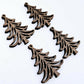 Two pairs of 35mm walnut veneer Cascade Christmas Tree dangle earring blanks laying flat on a white background