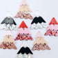 A mixture of the three non-traditional 40mm three piece Christmas Tree dangle earring blank designs laying flat on a white background