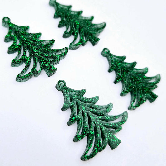 Two pairs of 35mm green glitter acrylic Cascade Christmas Tree dangle earring blanks laying flat on a white background.
