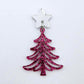One 35mm hot pink glitter acrylic Cascade Christmas Tree dangle earring blank assembled with a 16mm star topper, shown as a finished earring component