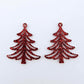 One pair of 35mm red glitter Cascade Christmas Tree dangle earring blanks laying flat on a white background