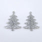 One pair of 35mm silver glitter acrylic Cascade Christmas Tree dangle earring blanks laying flat on a white background