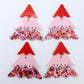 Two pairs of 40mm three piece Christmas Tree dangle earring blanks in Chunky Love Glitter, Pastel Pink and Solid Red acrylic laying flat on a white background