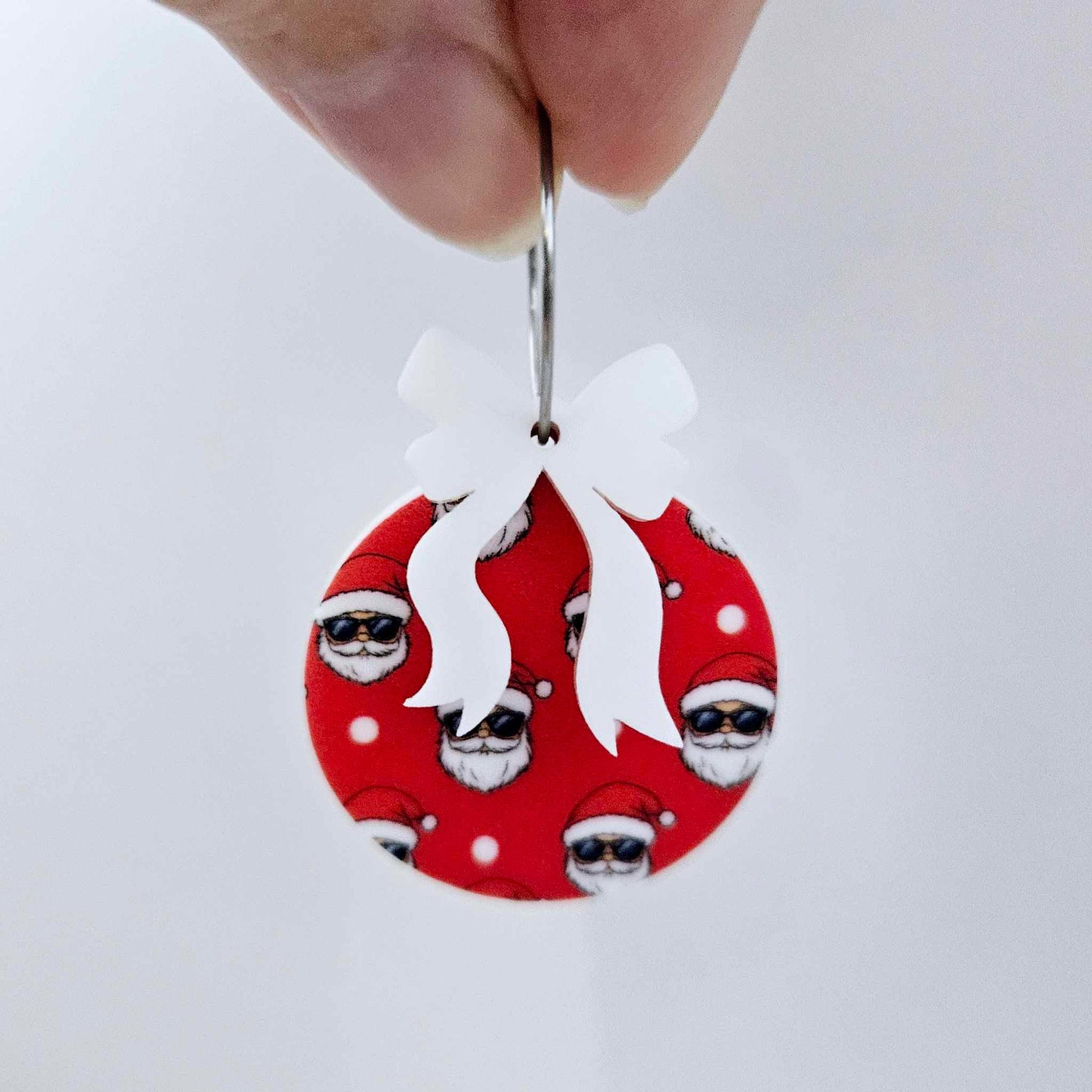 One Jolly Cool UV printed bauble and included white bow assembled on a 20mm hoop