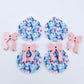 Two pairs of Snowman Wonderland UV printed bauble dangle blanks with included pastel pink bows laying flat