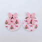 One pair of Pink Patchwork UV printed bauble dangle blanks with included pastel pink bows laying flat