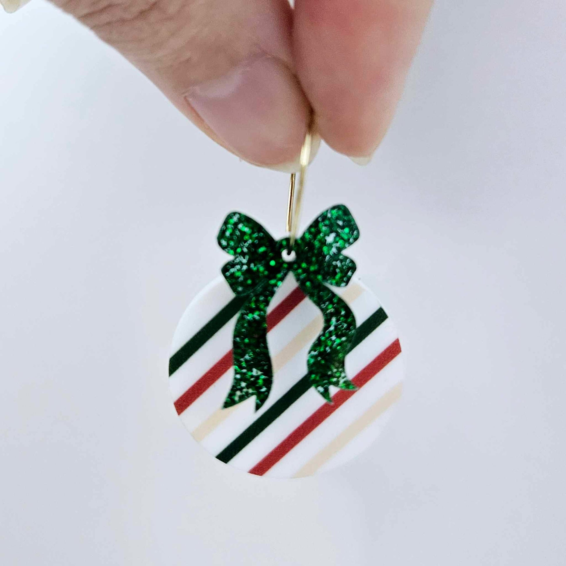 One Stripey Christmas UV printed bauble and included green glitter bow assembled on a 20mm hoop