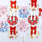 A selection of the five Fun Christmas UV printed bauble dangle earring blank designs with their coordinating bows laying flat.
