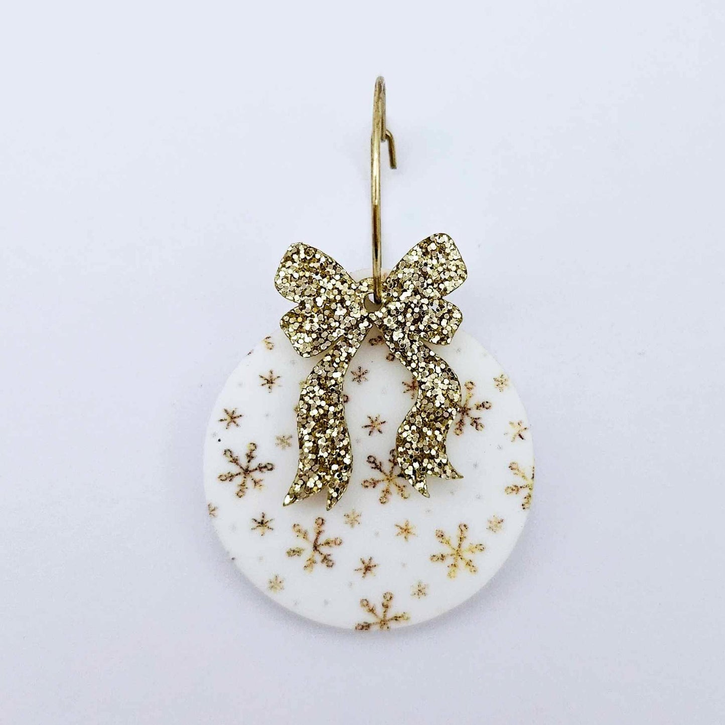 One Christmas Snowflake UV printed bauble dangle assembled on a 20mm hoop with a gold glitter bow 
