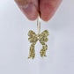 One gold glitter acrylic bow dangle earring blank assembled on a 20mm hoop
