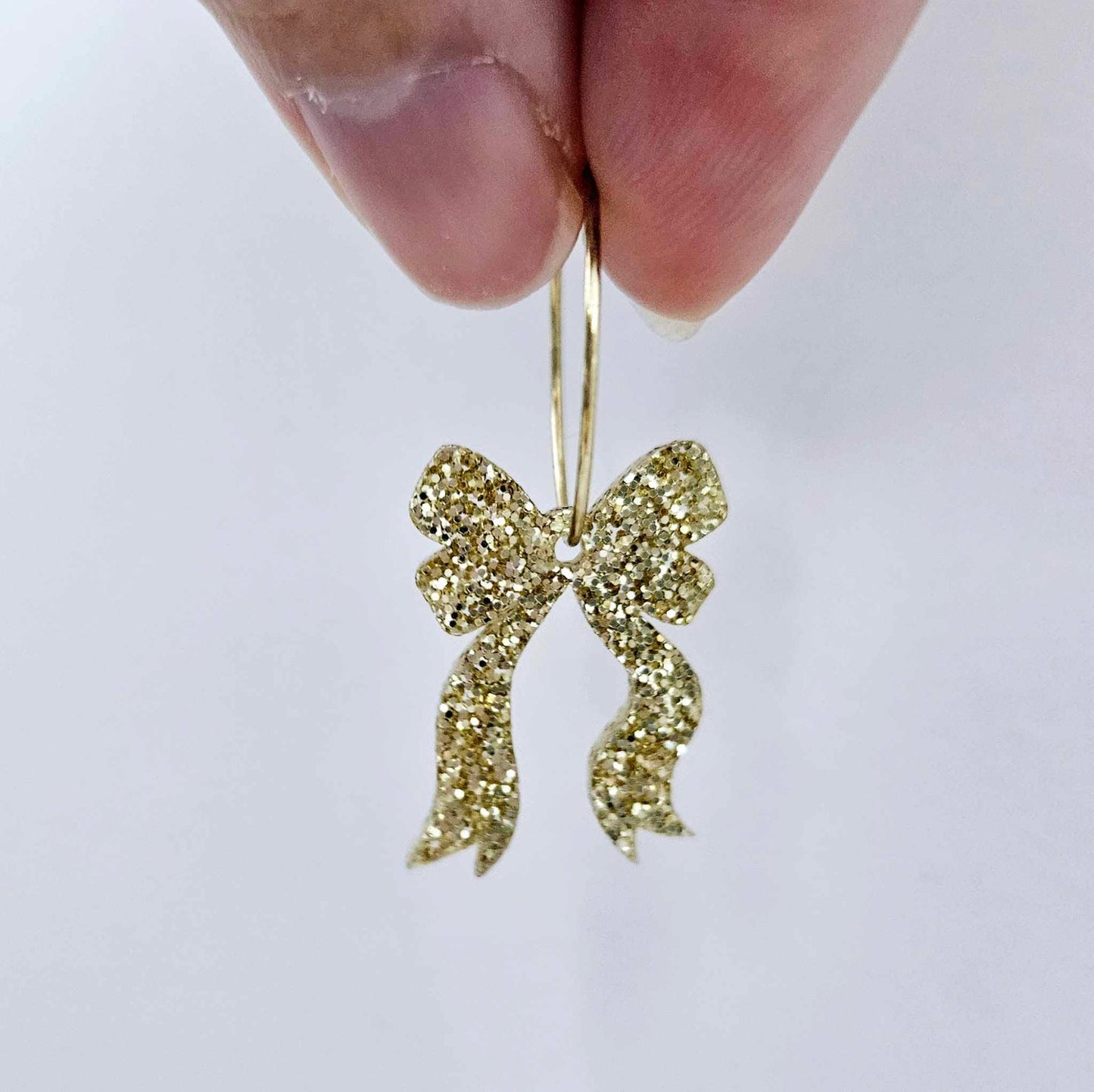 One gold glitter acrylic bow dangle earring blank assembled on a 20mm hoop
