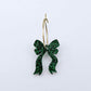 One green glitter acrylic bow dangle earring blank assembled on a 20mm hoop